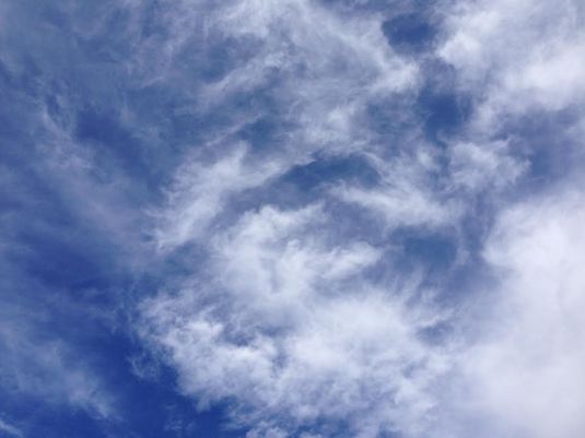 blue sky, wispy clouds