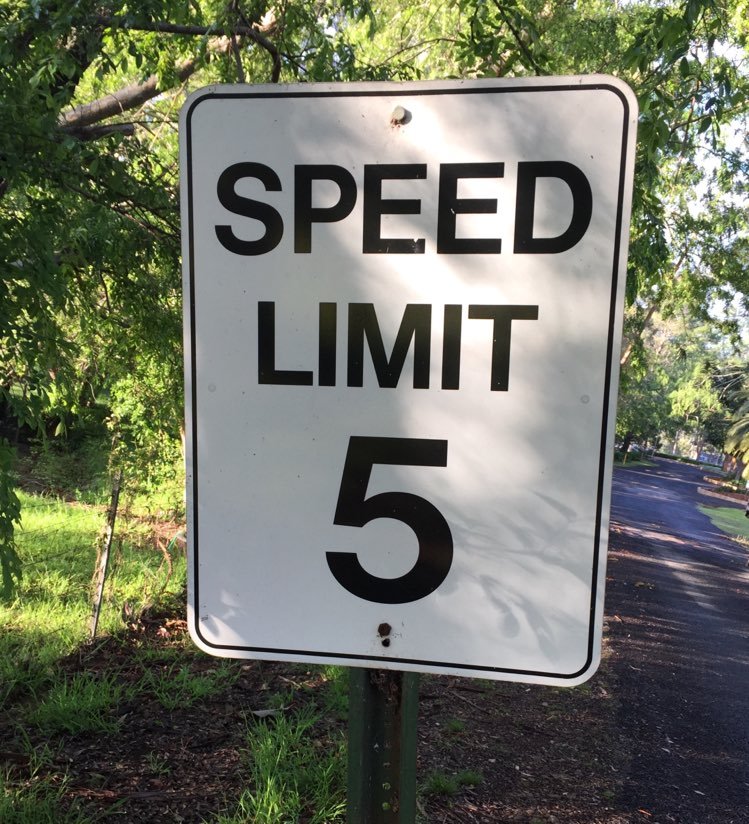 closer slow down sign