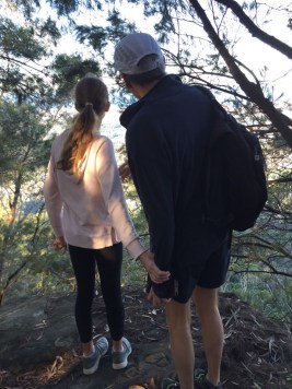 Holding hands looking at view